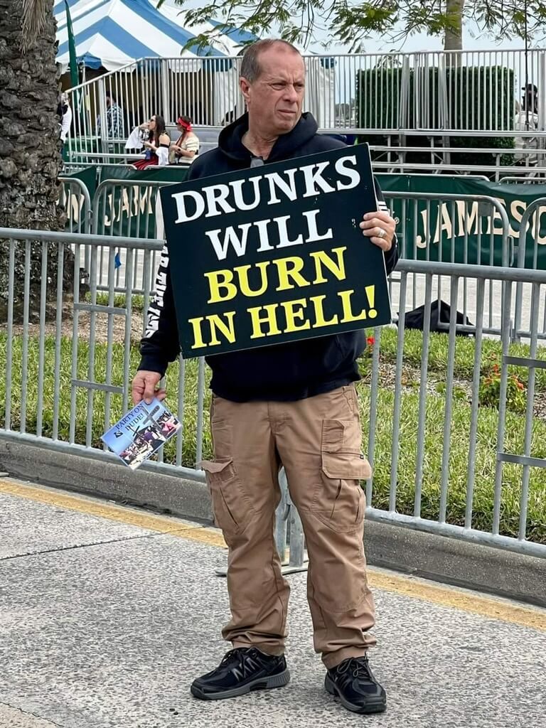 Street preaching with sign